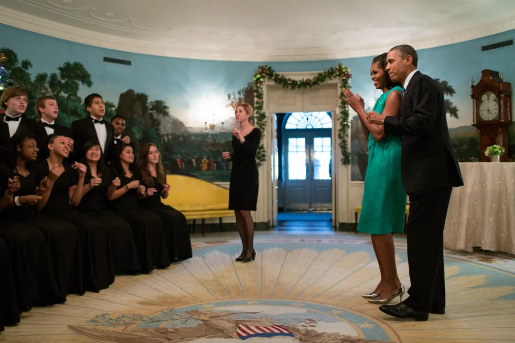 President Barack Obama and First Lady Michelle Obama listen to the Seneca Valley High School Chamber Choir