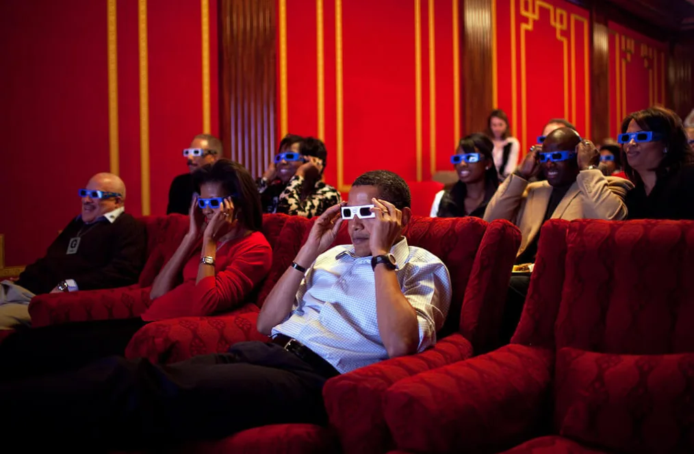 the President and First Lady join their guests in watching one of the TV commercials in 3D