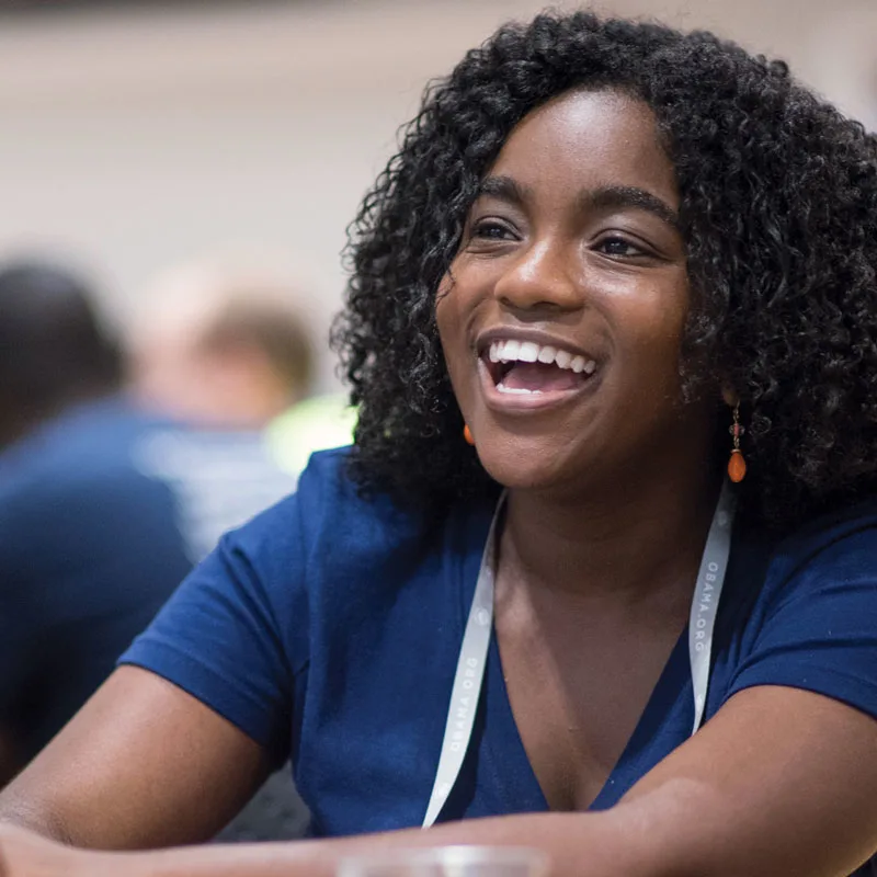 A young woman smiles.