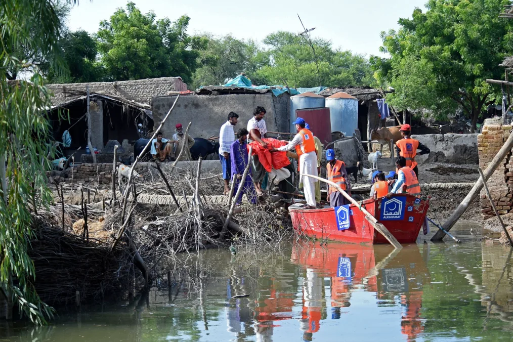 A picture of one group of people providing help to another group of people