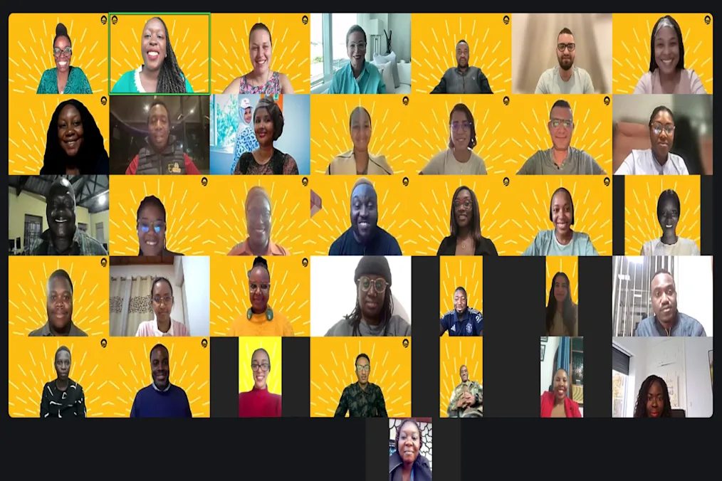 2024-2025 Leaders Africa participants join Valerie Jarrett on a Zoom call. Many have yellow screen backgrounds. All are a range of light to dark skin tones.