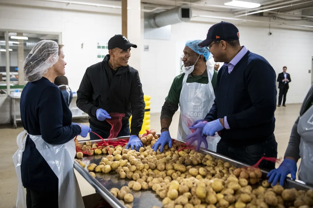 President Barack Obama participates in a service project at the Greater Chicago Food Depository in Chicago, IL