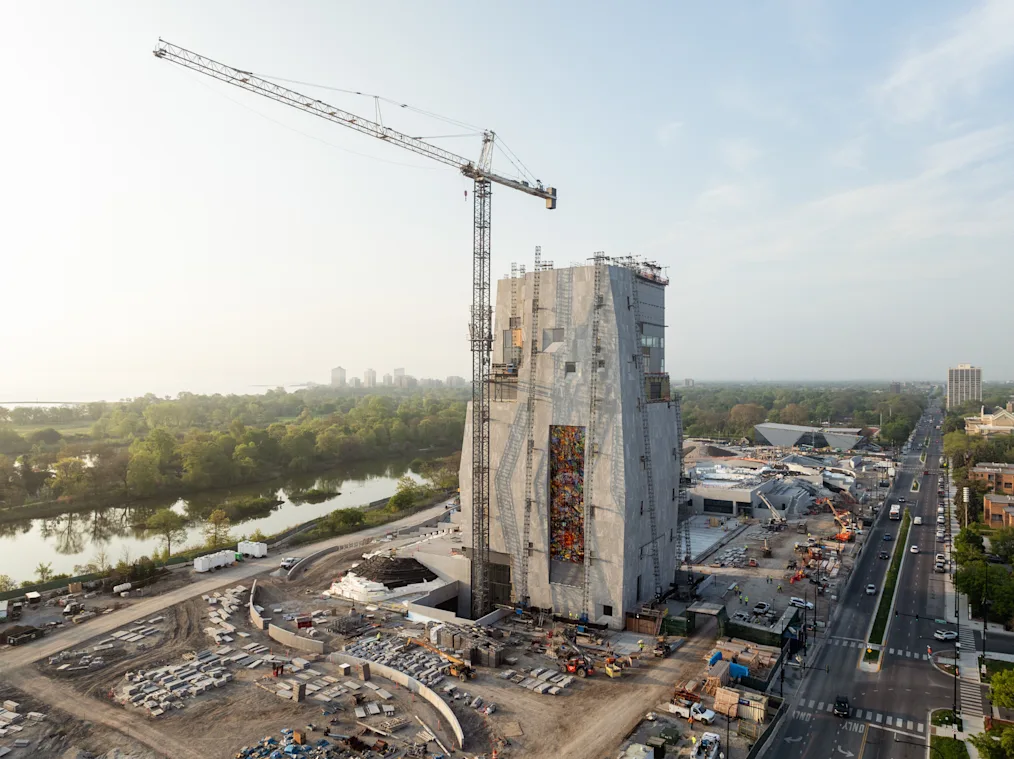 The Obama Presidential Center campus, facing north, features Julie Mehretu’s 83-foot-tall artwork “Uprising of the Sun” on May 15, 2025. (Credit: Angie McMongial)​​​​‌﻿‍﻿​‍​‍‌‍﻿﻿‌﻿​‍‌‍‍‌‌‍‌﻿‌‍‍‌‌‍﻿‍​‍​‍​﻿‍‍​‍​‍‌‍​﻿‌‍﻿﻿‌‍﻿‍‌﻿‌​‌‍‌‌‌‍﻿‍‌﻿‌​‌‍‌‍‌﻿‌‌‌‍﻿​​‍﻿‍‌‍​﻿‌‍﻿﻿‌‍﻿‌​‍​‍​‍﻿​​‍​‍‌‍‍​‌﻿​‍‌‍‌‌‌‍‌‍​‍​‍​﻿‍‍​‍​‍‌‍‍​‌﻿‌​‌﻿‌​‌﻿​​‌﻿​﻿​﻿‍‍​‍﻿﻿​‍﻿﻿‌‍​‌‌﻿​​‌﻿​​​‍﻿‍‌‍​﻿‌‍﻿﻿‌‍﻿‍‌﻿‌​‌‍‌‌‌‍﻿‍‌﻿‌​‌‍‌‍‌﻿‌‌‌‍﻿​​‍﻿‍‌‍​﻿‌‍﻿﻿‌‍﻿‌​‍﻿﻿‌﻿​﻿‌﻿​​‌‍​‌‌‍​﻿‌‍‌‌‌﻿​﻿​‍﻿﻿‌‍﻿​​﻿‌﻿‌‍‍​​﻿‌‌​﻿‍‌‌‍‍​‌‍‌‍‌‍﻿‍‌‍﻿​‌﻿‍​‌‍‍‍‌﻿‍​​‍﻿﻿‌‍‌‌‌‍﻿‍‌﻿‌‍‌‍‍‌‌﻿​‍‌‍﻿﻿‌‍﻿‍‌‍﻿‌‌‍‌‌‌‍﻿‍‌﻿‌​‌﻿​﻿​‍﻿﻿‌‍﻿‌‌‍​‌‌﻿​﻿‌﻿‌​‌‍‌‌‌﻿​‍​‍﻿﻿‌‍‌‌‌‍﻿‍‌﻿‌​‌﻿​‍‌‍‍‌‌‍‌‌‌﻿​﻿​‍﻿﻿​﻿​‍‌‌​‍‌﻿‌​‌‌‌‌​﻿‌‍‌﻿‍​‌​﻿‍‌​‍‍‌‌‍‍‌﻿‍‍​﻿‍‌‌‌​‌​﻿‍​‌‌‍​‌‍‍​‌​‍​‌‍﻿‍‌‍﻿‌‌​﻿﻿‌​﻿﻿‌‌​‌‌﻿‍​​‍﻿﻿​﻿﻿﻿‌‍‌‍‌‍﻿﻿‌‍​﻿‌﻿‌‌‌﻿​﻿‌‍‌‌‌‍‌​‌​‌‍‌‍‍‌‌‍‌‌‌‍﻿​‌‍‌​​﻿﻿‌‌‍​‌‌‍﻿​‌﻿‌​‌‌‌​‌‍‌‌‌﻿‍​‌﻿‌​​‍‌‍‌‍‌‍‌‍﻿﻿‌‍​﻿‌﻿‌‌‌﻿​﻿‌‍‌‌‌‍‌​‌​﻿​‌‍﻿﻿‌‍​﻿‌‍​‌‌‍﻿​‌‍‌‌​﻿﻿‌‌‍‌‌‌‍﻿‍​‍﻿‌‌‌‌‌‌‌​﻿​‍‌‍‌﻿​﻿‌‍﻿﻿‌﻿‌‌‌﻿​‍‌‍​﻿‌‍‌‌​﻿﻿‌‌﻿‌‍‌‍‌‌‌﻿​‍‌‍​﻿‌‍‌‌‌‍﻿​​‍﻿‌‌‍​﻿‌‍﻿﻿‌‍﻿‍‌﻿‌​‌‍‌‌‌‍﻿‍‌﻿‌​​‍﻿‌‌‍﻿​‌‍‍‌‌‍﻿‍‌‍‍﻿​‍​‍​‍﻿​​‍​‍‌‍​﻿‌‍﻿﻿‌‍﻿‍‌﻿‌​‌‍‌‌‌‍﻿‍‌﻿‌​‌‍‌‍‌﻿‌‌‌‍﻿​​‍​‍​﻿‍‍‌﻿‍﻿​‍​‍‌‍‌‌‌‍‌​‌‍‍‌‌﻿‌​‌‍﻿﻿‌﻿​‍‌​‍‌‌‍﻿‍‌﻿‌​‌‍‌‌‌﻿​‍‌‍‌‍‌‍​‌‌‍​﻿‌‍‌‌​‍​‍​﻿‍‍‌﻿‍﻿​‍​‍‌﻿‌﻿‌‍‍‌‌‍‌​‌‍‌﻿‌‍‌‌‌﻿‌​‌​‍‌‌‍‌​​‍​‍​﻿‍‍​‍​‍‌‍﻿‌‌﻿‌‌‌‍﻿​‌﻿‌​‌‍‍‌‌﻿​​‌‍﻿​‌‍‌‌‌​﻿​‌‍‍‌‌‍﻿‍‌‍‌‌​‍​‍​‍﻿​​‍​‍‌﻿‌﻿‌‍‍‌‌‍‌​‌‍‌﻿‌‍‌‌‌﻿‌​‌​﻿‍‌‍​‌‌‍﻿‌‌‍‌‌‌﻿​﻿‌﻿​​‌‍​‌‌‍​﻿‌‍‌‌​‍​‍​﻿‍‍​‍​‍‌‍​‍‌﻿‌‌‌‍‍‌‌‍﻿​‌﻿‌​‌‍‍‌‌‍﻿‍​‍​‍‌﻿﻿‌​‍﻿​​‍​‍‌‍‌‍‌‍‍‌‌‍‌‌‌‍﻿​‌‍‌​‌‌‌​‌﻿‍‌‌﻿​​‌‍‌‌​‍​‍​﻿‍‍​‍​‍‌‌‌​‌‍‌‌‌﻿‍​‌﻿‌​​‍​‍‌﻿﻿‌‌﻿﻿‌