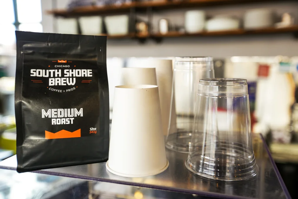 A counter displaying South Shore Brew coffee and coffee cups.