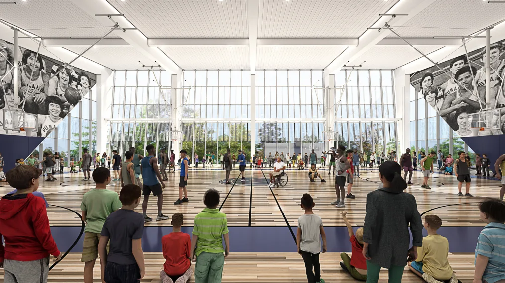 A rendering of the future Obama Presidential Center Athletic  Center. A brightly lit basketball court is filled with people watching and engaging in activity. 