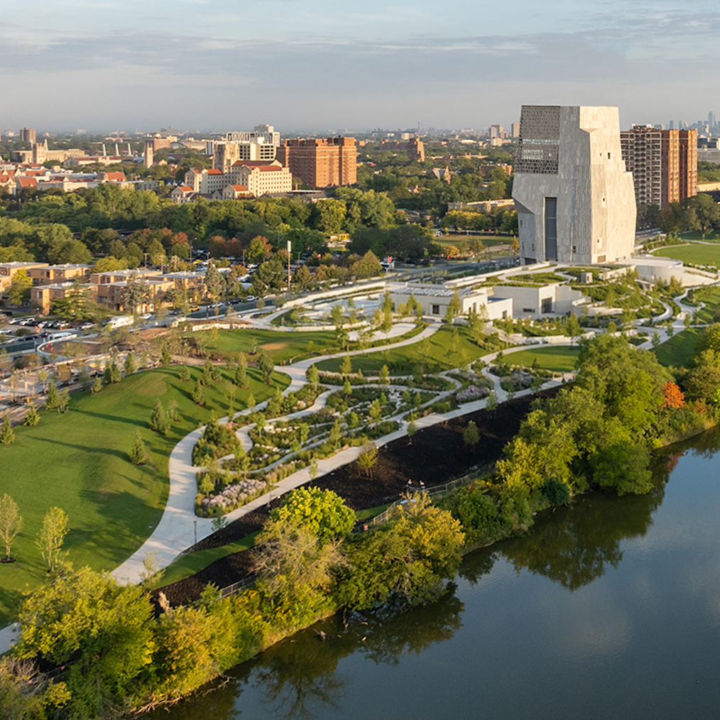 On a bright day, the Obama Presidential Center campus is seen facing south in Chicago in September 2025. The Columbia Basin, Wooded Island, Jackson Park Lagoon Loop is in the foreground and the Obama Presidential Center is in the background. (Credit: Angie McMongial)