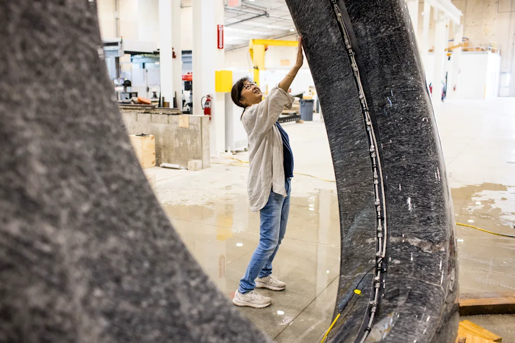 Artist and architect Maya Lin, an Asian woman with a light skin tone, rubs and reviews her sculpture titled, “Seeing Through the Universe,” at Quarra Stone Company in Sun Prairie, Wisconsin, on July 14, 2025. Maya Lin is wearing jeans and a white button up shirt. ​​​​‌﻿‍﻿​‍​‍‌‍﻿﻿‌﻿​‍‌‍‍‌‌‍‌﻿‌‍‍‌‌‍﻿‍​‍​‍​﻿‍‍​‍​‍‌‍​﻿‌‍﻿﻿‌‍﻿‍‌﻿‌​‌‍‌‌‌‍﻿‍‌﻿‌​‌‍‌‍‌﻿‌‌‌‍﻿​​‍﻿‍‌‍​﻿‌‍﻿﻿‌‍﻿‌​‍​‍​‍﻿​​‍​‍‌‍‍​‌﻿​‍‌‍‌‌‌‍‌‍​‍​‍​﻿‍‍​‍​‍‌‍‍​‌﻿‌​‌﻿‌​‌﻿​​‌﻿​﻿​﻿‍‍​‍﻿﻿​‍﻿﻿‌‍​‌‌﻿​​‌﻿​​​‍﻿‍‌‍​﻿‌‍﻿﻿‌‍﻿‍‌﻿‌​‌‍‌‌‌‍﻿‍‌﻿‌​‌‍‌‍‌﻿‌‌‌‍﻿​​‍﻿‍‌‍​﻿‌‍﻿﻿‌‍﻿‌​‍﻿﻿‌﻿​﻿‌﻿​​‌‍​‌‌‍​﻿‌‍‌‌‌﻿​﻿​‍﻿﻿‌‍﻿​​﻿‌﻿‌‍‍​​﻿‌‌​﻿‍‌‌‍‍​‌‍‌‍‌‍﻿‍‌‍﻿​‌﻿‍​‌‍‍‍‌﻿‍​​‍﻿﻿‌‍‌‌‌‍﻿‍‌﻿‌‍‌‍‍‌‌﻿​‍‌‍﻿﻿‌‍﻿‍‌‍﻿‌‌‍‌‌‌‍﻿‍‌﻿‌​‌﻿​﻿​‍﻿﻿‌‍﻿‌‌‍​‌‌﻿​﻿‌﻿‌​‌‍‌‌‌﻿​‍​‍﻿﻿‌‍‌‌‌‍﻿‍‌﻿‌​‌﻿​‍‌‍‍‌‌‍‌‌‌﻿​﻿​‍﻿﻿​﻿​﻿‌​​﻿‌​‍‌‌​‌﻿‌﻿‌‍‌‌‍​‌‍‍​‌﻿‌﻿​﻿‍​‌‍﻿‍‌‌‍‌‌‌‌‍‌‍‍﻿‌﻿‌﻿‌‌​‍‌‍﻿‌‌‌​‍‌​﻿‍‌​‍‍‌‌‍​‌﻿‍​‌‍‍‌​‍﻿﻿​﻿﻿﻿‌‍‌‍‌‍﻿﻿‌‍​﻿‌﻿‌‌‌﻿​﻿‌‍‌‌‌‍‌​‌​‌‍‌‍‍‌‌‍‌‌‌‍﻿​‌‍‌​​﻿﻿‌‌‍​‌‌‍﻿​‌﻿‌​‌‌‌​‌‍‌‌‌﻿‍​‌﻿‌​​‍‌‍‌‍‌‍‌‍﻿﻿‌‍​﻿‌﻿‌‌‌﻿​﻿‌‍‌‌‌‍‌​‌​﻿​‌‍﻿﻿‌‍​﻿‌‍​‌‌‍﻿​‌‍‌‌​﻿﻿‌‌‍‌‌‌‍﻿‍​‍﻿‌‌‌‌‌‌‌​﻿​‍‌‍‌﻿​﻿‌‍﻿﻿‌﻿‌‌‌﻿​‍‌‍​﻿‌‍‌‌​﻿﻿‌‌﻿‌‍‌‍‌‌‌﻿​‍‌‍​﻿‌‍‌‌‌‍﻿​​‍﻿‌‌‍​﻿‌‍﻿﻿‌‍﻿‍‌﻿‌​‌‍‌‌‌‍﻿‍‌﻿‌​​‍﻿‌‌‍﻿​‌‍‍‌‌‍﻿‍‌‍‍﻿​‍​‍​‍﻿​​‍​‍‌‍​﻿‌‍﻿﻿‌‍﻿‍‌﻿‌​‌‍‌‌‌‍﻿‍‌﻿‌​‌‍‌‍‌﻿‌‌‌‍﻿​​‍​‍​﻿‍‍‌﻿‍﻿​‍​‍‌‍‌‌‌‍‌​‌‍‍‌‌﻿‌​‌‍﻿﻿‌﻿​‍‌​‍‌‌‍﻿‍‌﻿‌​‌‍‌‌‌﻿​‍‌‍‌‍‌‍​‌‌‍​﻿‌‍‌‌​‍​‍​﻿‍‍‌﻿‍﻿​‍​‍‌﻿‌﻿‌‍‍‌‌‍‌​‌‍‌﻿‌‍‌‌‌﻿‌​‌​‍‌‌‍‌​​‍​‍​﻿‍‍​‍​‍‌‍﻿‌‌﻿‌‌‌‍﻿​‌﻿‌​‌‍‍‌‌﻿​​‌‍﻿​‌‍‌‌‌​﻿​‌‍‍‌‌‍﻿‍‌‍‌‌​‍​‍​‍﻿​​‍​‍‌﻿‌﻿‌‍‍‌‌‍‌​‌‍‌﻿‌‍‌‌‌﻿‌​‌​﻿‍‌‍​‌‌‍﻿‌‌‍‌‌‌﻿​﻿‌﻿​​‌‍​‌‌‍​﻿‌‍‌‌​‍​‍​﻿‍‍​‍​‍‌‍​‍‌﻿‌‌‌‍‍‌‌‍﻿​‌﻿‌​‌‍‍‌‌‍﻿‍​‍​‍‌﻿﻿‌​‍﻿​​‍​‍‌‍‌‍‌‍‍‌‌‍‌‌‌‍﻿​‌‍‌​‌‌‌​‌﻿‍‌‌﻿​​‌‍‌‌​‍​‍​﻿‍‍​‍​‍‌‌‌​‌‍‌‌‌﻿‍​‌﻿‌​​‍​‍‌﻿﻿‌‌﻿﻿‌
