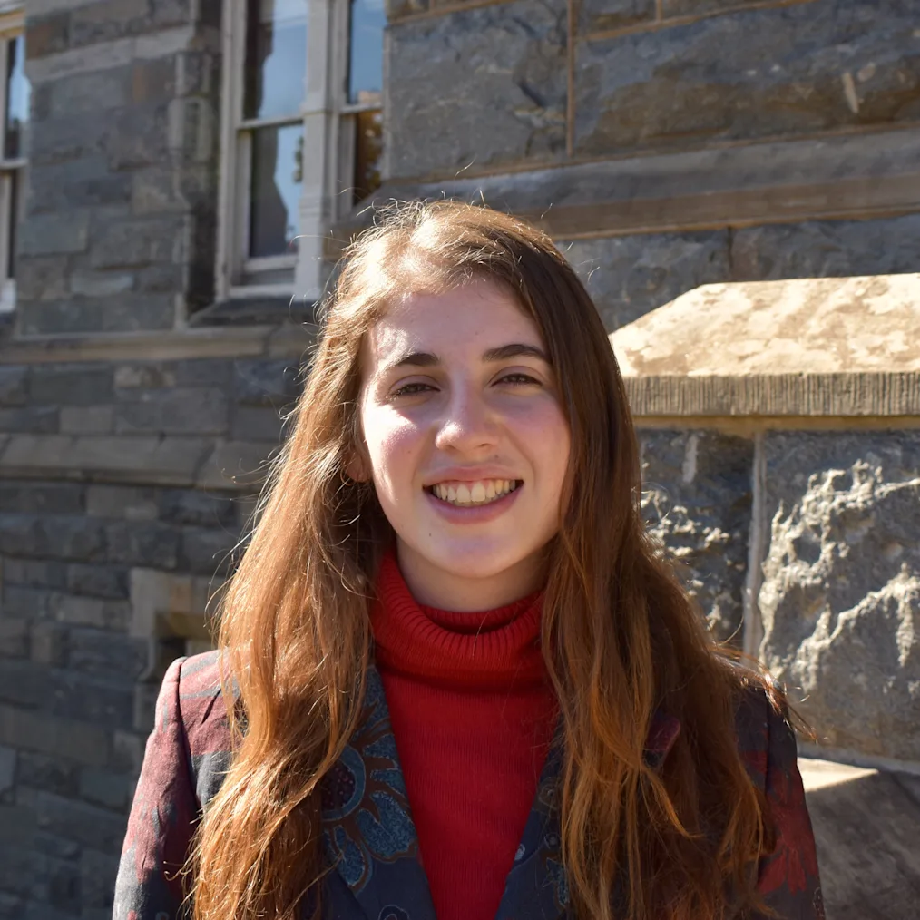 Isabella Stratta, a young woman with a light skin tone and long brown hair smiles at the camera. She is wearing a red turtle neck and a red and navy blazer. ​​​​‌﻿‍﻿​‍​‍‌‍﻿﻿‌﻿​‍‌‍‍‌‌‍‌﻿‌‍‍‌‌‍﻿‍​‍​‍​﻿‍‍​‍​‍‌‍​﻿‌‍﻿﻿‌‍﻿‍‌﻿‌​‌‍‌‌‌‍﻿‍‌﻿‌​‌‍‌‍‌﻿‌‌‌‍﻿​​‍﻿‍‌‍​﻿‌‍﻿﻿‌‍﻿‌​‍​‍​‍﻿​​‍​‍‌‍‍​‌﻿​‍‌‍‌‌‌‍‌‍​‍​‍​﻿‍‍​‍​‍‌‍‍​‌﻿‌​‌﻿‌​‌﻿​​‌﻿​﻿​﻿‍‍​‍﻿﻿​‍﻿﻿‌‍​‌‌﻿​​‌﻿​​​‍﻿‍‌‍​﻿‌‍﻿﻿‌‍﻿‍‌﻿‌​‌‍‌‌‌‍﻿‍‌﻿‌​‌‍‌‍‌﻿‌‌‌‍﻿​​‍﻿‍‌‍​﻿‌‍﻿﻿‌‍﻿‌​‍﻿﻿‌﻿​﻿‌﻿​​‌‍​‌‌‍​﻿‌‍‌‌‌﻿​﻿​‍﻿﻿‌‍﻿​​﻿‌﻿‌‍‍​​﻿‌‌​﻿‍‌‌‍‍​‌‍‌‍‌‍﻿‍‌‍﻿​‌﻿‍​‌‍‍‍‌﻿‍​​‍﻿﻿‌‍‌‌‌‍﻿‍‌﻿‌‍‌‍‍‌‌﻿​‍‌‍﻿﻿‌‍﻿‍‌‍﻿‌‌‍‌‌‌‍﻿‍‌﻿‌​‌﻿​﻿​‍﻿﻿‌‍﻿‌‌‍​‌‌﻿​﻿‌﻿‌​‌‍‌‌‌﻿​‍​‍﻿﻿‌‍‌‌‌‍﻿‍‌﻿‌​‌﻿​‍‌‍‍‌‌‍‌‌‌﻿​﻿​‍﻿﻿​﻿​‌​﻿‍​‌‌​‍‌​‌‍​﻿‌​‌‍‌﻿‌‌‌‌​﻿‍​​﻿‍‌‌​​﻿‌​﻿﻿‌​‍‌‌‍﻿​‌​​﻿‌​‍‌‌‌​﻿‌‍﻿﻿‌‌​​‌‍‍﻿‌​​‍‌‍‍‍‌​﻿﻿​‍﻿﻿​﻿﻿﻿‌‍‌‍‌‍﻿﻿‌‍​﻿‌﻿‌‌‌﻿​﻿‌‍‌‌‌‍‌​‌​‌‍‌‍‍‌‌‍‌‌‌‍﻿​‌‍‌​​﻿﻿‌‌‍​‌‌‍﻿​‌﻿‌​‌‌‌​‌‍‌‌‌﻿‍​‌﻿‌​​‍‌‍‌‍‌‍‌‍﻿﻿‌‍​﻿‌﻿‌‌‌﻿​﻿‌‍‌‌‌‍‌​‌​﻿​‌‍﻿﻿‌‍​﻿‌‍​‌‌‍﻿​‌‍‌‌​﻿﻿‌‌‍‌‌‌‍﻿‍​‍﻿‌‌‌‌‌‌‌​﻿​‍‌‍‌﻿​﻿‌‍﻿﻿‌﻿‌‌‌﻿​‍‌‍​﻿‌‍‌‌​﻿﻿‌‌﻿‌‍‌‍‌‌‌﻿​‍‌‍​﻿‌‍‌‌‌‍﻿​​‍﻿‌‌‍​﻿‌‍﻿﻿‌‍﻿‍‌﻿‌​‌‍‌‌‌‍﻿‍‌﻿‌​​‍﻿‌‌‍﻿​‌‍‍‌‌‍﻿‍‌‍‍﻿​‍​‍​‍﻿​​‍​‍‌‍​﻿‌‍﻿﻿‌‍﻿‍‌﻿‌​‌‍‌‌‌‍﻿‍‌﻿‌​‌‍‌‍‌﻿‌‌‌‍﻿​​‍​‍​﻿‍‍‌﻿‍﻿​‍​‍‌‍‌‌‌‍‌​‌‍‍‌‌﻿‌​‌‍﻿﻿‌﻿​‍‌​‍‌‌‍﻿‍‌﻿‌​‌‍‌‌‌﻿​‍‌‍‌‍‌‍​‌‌‍​﻿‌‍‌‌​‍​‍​﻿‍‍‌﻿‍﻿​‍​‍‌﻿‌﻿‌‍‍‌‌‍‌​‌‍‌﻿‌‍‌‌‌﻿‌​‌​‍‌‌‍‌​​‍​‍​﻿‍‍​‍​‍‌‍﻿‌‌﻿‌‌‌‍﻿​‌﻿‌​‌‍‍‌‌﻿​​‌‍﻿​‌‍‌‌‌​﻿​‌‍‍‌‌‍﻿‍‌‍‌‌​‍​‍​‍﻿​​‍​‍‌﻿‌﻿‌‍‍‌‌‍‌​‌‍‌﻿‌‍‌‌‌﻿‌​‌​﻿‍‌‍​‌‌‍﻿‌‌‍‌‌‌﻿​﻿‌﻿​​‌‍​‌‌‍​﻿‌‍‌‌​‍​‍​﻿‍‍​‍​‍‌‍​‍‌﻿‌‌‌‍‍‌‌‍﻿​‌﻿‌​‌‍‍‌‌‍﻿‍​‍​‍‌﻿﻿‌​‍﻿​​‍​‍‌‍‌‍‌‍‍‌‌‍‌‌‌‍﻿​‌‍‌​‌‌‌​‌﻿‍‌‌﻿​​‌‍‌‌​‍​‍​﻿‍‍​‍​‍‌‌‌​‌‍‌‌‌﻿‍​‌﻿‌​​‍​‍‌﻿﻿‌‌﻿﻿‌