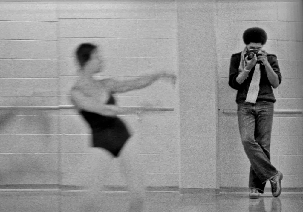 (1980) Chicago Defender photographer, Antonio Dickey photographing dancer Tarin Springs practicing dance routine.
