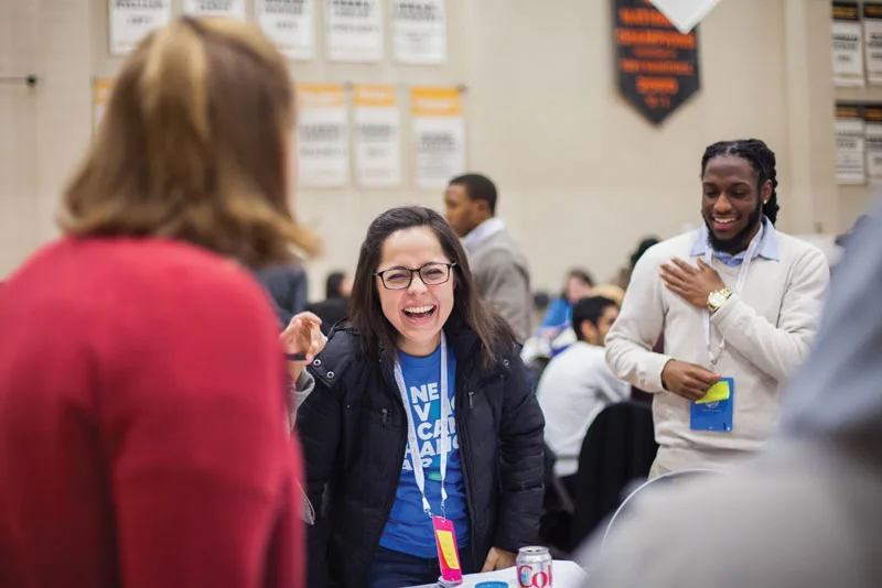 A young woman laughs during an Obama Foundation Training Day in 2017.