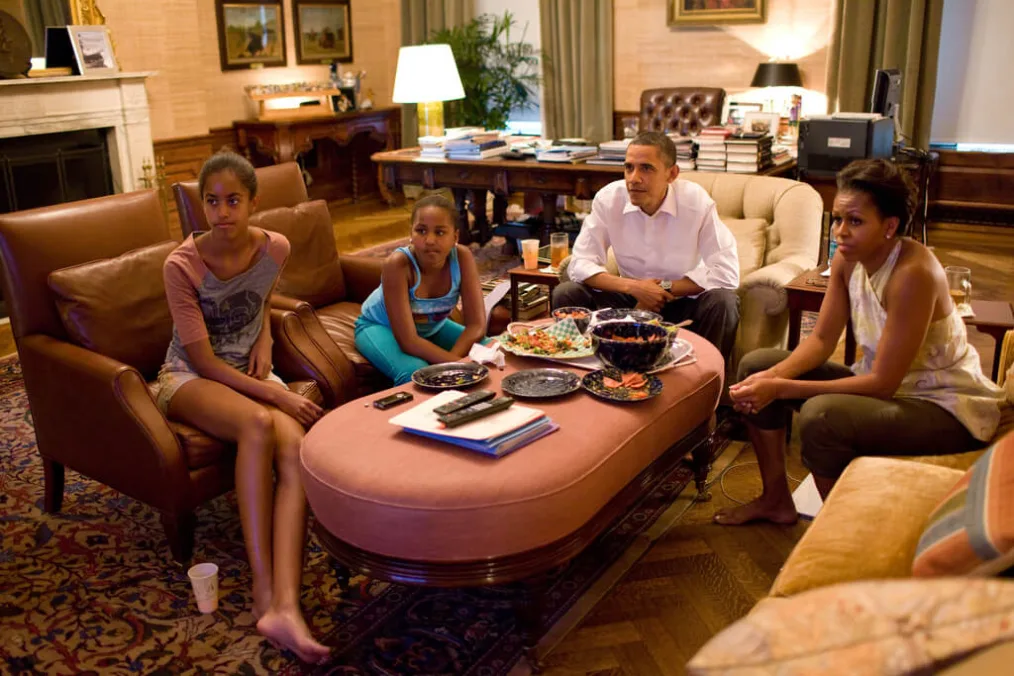 President Barack Obama, First Lady Michelle Obama, and their daughters Sasha and Malia watch the World Cup soccer game