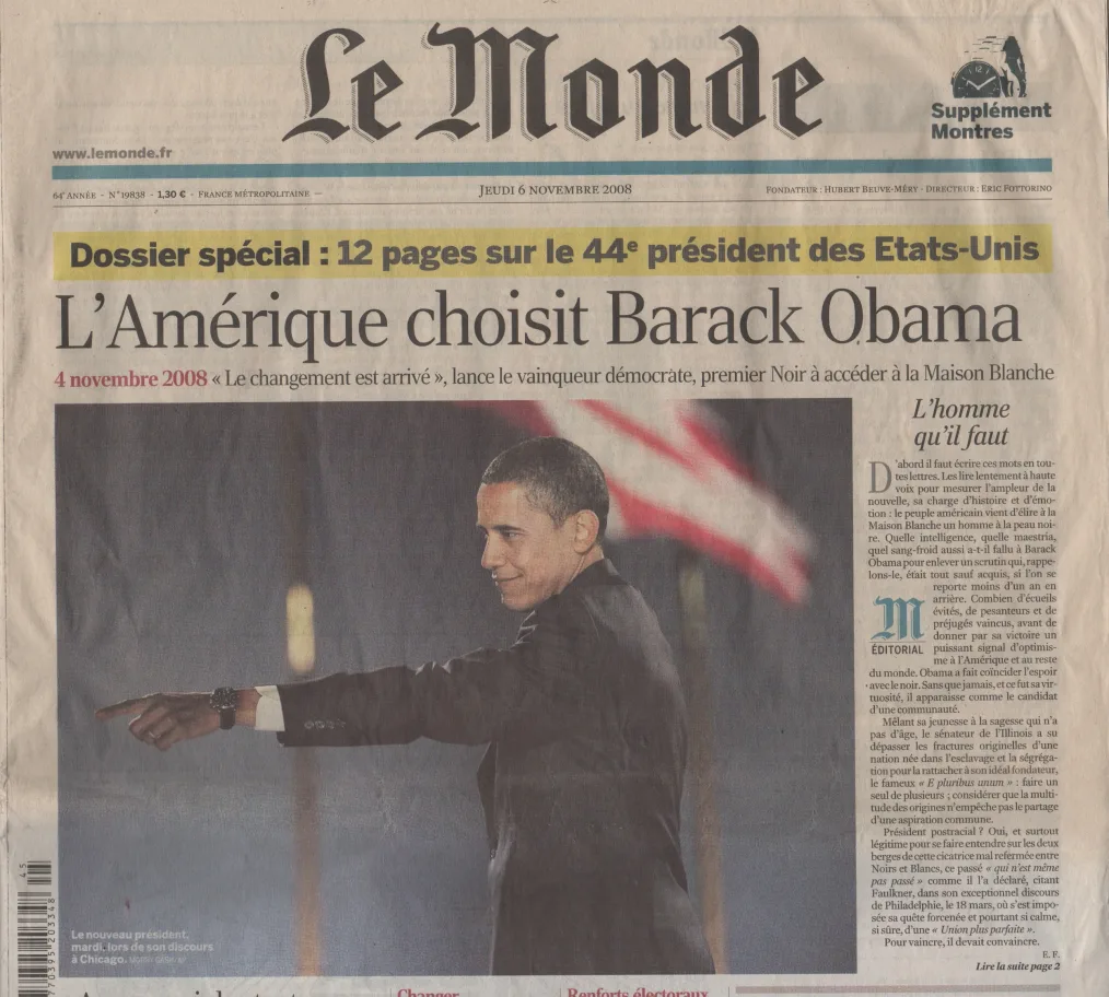 The front page of Le Monde newspaper with the headline "L'Amerique choisit Barack Obama" and a photo of Barack Obama pointing to the left.