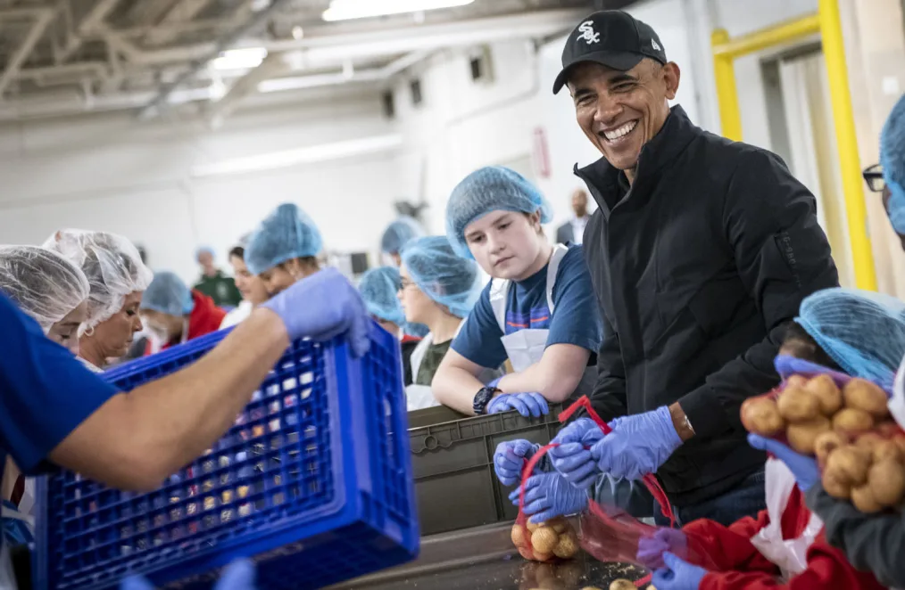 President Barack Obama participates in a service project at the Greater Chicago Food Depository in Chicago, IL