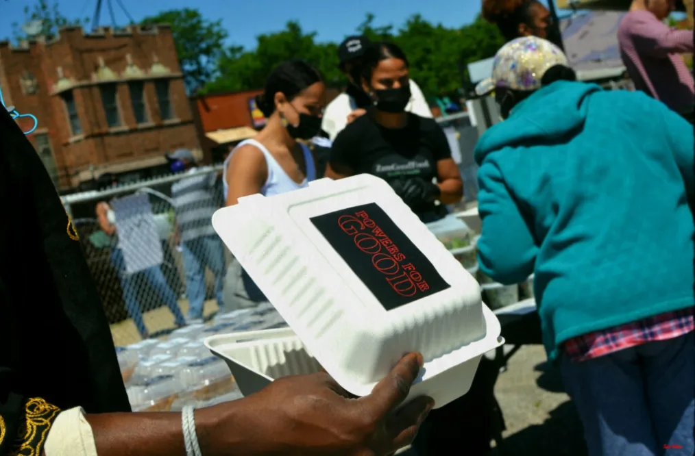A takeout food box that reads "powers for good."