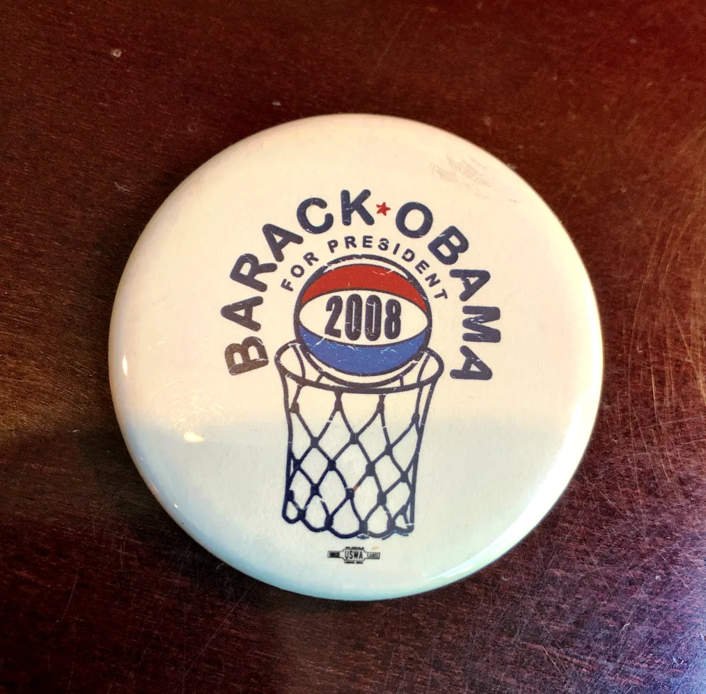 White button with a basketball and hoop. Barack Obama is written across the top.