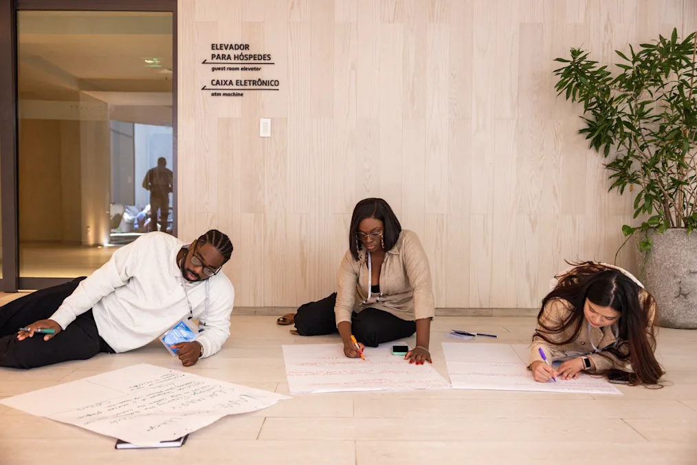 Members of the Obama Leaders Network, all have a range of light to dark skin tones, gather in Rio de Janeiro, Brazil, on Nov. 11, 2025, ahead of the COP30 Summit in Belém, Brazil. They are all sitting on the floor and writing on large pieces of paper.​​​​‌﻿‍﻿​‍​‍‌‍﻿﻿‌﻿​‍‌‍‍‌‌‍‌﻿‌‍‍‌‌‍﻿‍​‍​‍​﻿‍‍​‍​‍‌‍​﻿‌‍﻿﻿‌‍﻿‍‌﻿‌​‌‍‌‌‌‍﻿‍‌﻿‌​‌‍‌‍‌﻿‌‌‌‍﻿​​‍﻿‍‌‍​﻿‌‍﻿﻿‌‍﻿‌​‍​‍​‍﻿​​‍​‍‌‍‍​‌﻿​‍‌‍‌‌‌‍‌‍​‍​‍​﻿‍‍​‍​‍‌‍‍​‌﻿‌​‌﻿‌​‌﻿​​‌﻿​﻿​﻿‍‍​‍﻿﻿​‍﻿﻿‌‍​‌‌﻿​​‌﻿​​​‍﻿‍‌‍​﻿‌‍﻿﻿‌‍﻿‍‌﻿‌​‌‍‌‌‌‍﻿‍‌﻿‌​‌‍‌‍‌﻿‌‌‌‍﻿​​‍﻿‍‌‍​﻿‌‍﻿﻿‌‍﻿‌​‍﻿﻿‌﻿​﻿‌﻿​​‌‍​‌‌‍​﻿‌‍‌‌‌﻿​﻿​‍﻿﻿‌‍﻿​​﻿‌﻿‌‍‍​​﻿‌‌​﻿‍‌‌‍‍​‌‍‌‍‌‍﻿‍‌‍﻿​‌﻿‍​‌‍‍‍‌﻿‍​​‍﻿﻿‌‍‌‌‌‍﻿‍‌﻿‌‍‌‍‍‌‌﻿​‍‌‍﻿﻿‌‍﻿‍‌‍﻿‌‌‍‌‌‌‍﻿‍‌﻿‌​‌﻿​﻿​‍﻿﻿‌‍﻿‌‌‍​‌‌﻿​﻿‌﻿‌​‌‍‌‌‌﻿​‍​‍﻿﻿‌‍‌‌‌‍﻿‍‌﻿‌​‌﻿​‍‌‍‍‌‌‍‌‌‌﻿​﻿​‍﻿﻿​﻿‌‌‌‍​‌‌‍﻿‍‌‍‌‌‌​​﻿‌‍​‍​﻿‌​‌​​‌‌‍​﻿‌​​﻿‌﻿​​‌﻿‍‍‌﻿​‍‌‍﻿‍‌‍‍﻿​﻿‌‌‌﻿​​‌‌‍‍‌‍‌‌​﻿‌‌‌﻿​‌‌﻿‍​​‍﻿﻿​﻿﻿﻿‌‍‌‍‌‍﻿﻿‌‍​﻿‌﻿‌‌‌﻿​﻿‌‍‌‌‌‍‌​‌​‌‍‌‍‍‌‌‍‌‌‌‍﻿​‌‍‌​​﻿﻿‌‌‍​‌‌‍﻿​‌﻿‌​‌‌‌​‌‍‌‌‌﻿‍​‌﻿‌​​‍‌‍‌‍‌‍‌‍﻿﻿‌‍​﻿‌﻿‌‌‌﻿​﻿‌‍‌‌‌‍‌​‌​﻿​‌‍﻿﻿‌‍​﻿‌‍​‌‌‍﻿​‌‍‌‌​﻿﻿‌‌‍‌‌‌‍﻿‍​‍﻿‌‌‌‌‌‌‌​﻿​‍‌‍‌﻿​﻿‌‍﻿﻿‌﻿‌‌‌﻿​‍‌‍​﻿‌‍‌‌​﻿﻿‌‌﻿‌‍‌‍‌‌‌﻿​‍‌‍​﻿‌‍‌‌‌‍﻿​​‍﻿‌‌‍​﻿‌‍﻿﻿‌‍﻿‍‌﻿‌​‌‍‌‌‌‍﻿‍‌﻿‌​​‍﻿‌‌‍﻿​‌‍‍‌‌‍﻿‍‌‍‍﻿​‍​‍​‍﻿​​‍​‍‌‍​﻿‌‍﻿﻿‌‍﻿‍‌﻿‌​‌‍‌‌‌‍﻿‍‌﻿‌​‌‍‌‍‌﻿‌‌‌‍﻿​​‍​‍​﻿‍‍‌﻿‍﻿​‍​‍‌‍‌‌‌‍‌​‌‍‍‌‌﻿‌​‌‍﻿﻿‌﻿​‍‌​‍‌‌‍﻿‍‌﻿‌​‌‍‌‌‌﻿​‍‌‍‌‍‌‍​‌‌‍​﻿‌‍‌‌​‍​‍​﻿‍‍‌﻿‍﻿​‍​‍‌﻿‌﻿‌‍‍‌‌‍‌​‌‍‌﻿‌‍‌‌‌﻿‌​‌​‍‌‌‍‌​​‍​‍​﻿‍‍​‍​‍‌‍﻿‌‌﻿‌‌‌‍﻿​‌﻿‌​‌‍‍‌‌﻿​​‌‍﻿​‌‍‌‌‌​﻿​‌‍‍‌‌‍﻿‍‌‍‌‌​‍​‍​‍﻿​​‍​‍‌﻿‌﻿‌‍‍‌‌‍‌​‌‍‌﻿‌‍‌‌‌﻿‌​‌​﻿‍‌‍​‌‌‍﻿‌‌‍‌‌‌﻿​﻿‌﻿​​‌‍​‌‌‍​﻿‌‍‌‌​‍​‍​﻿‍‍​‍​‍‌‍​‍‌﻿‌‌‌‍‍‌‌‍﻿​‌﻿‌​‌‍‍‌‌‍﻿‍​‍​‍‌﻿﻿‌​‍﻿​​‍​‍‌‍‌‍‌‍‍‌‌‍‌‌‌‍﻿​‌‍‌​‌‌‌​‌﻿‍‌‌﻿​​‌‍‌‌​‍​‍​﻿‍‍​‍​‍‌‌‌​‌‍‌‌‌﻿‍​‌﻿‌​​‍​‍‌﻿﻿‌‌﻿﻿‌
