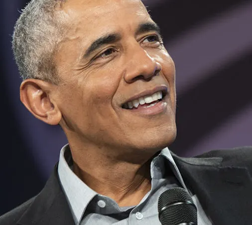In this portrait, President Obama smiles looking to the right out of frame.
