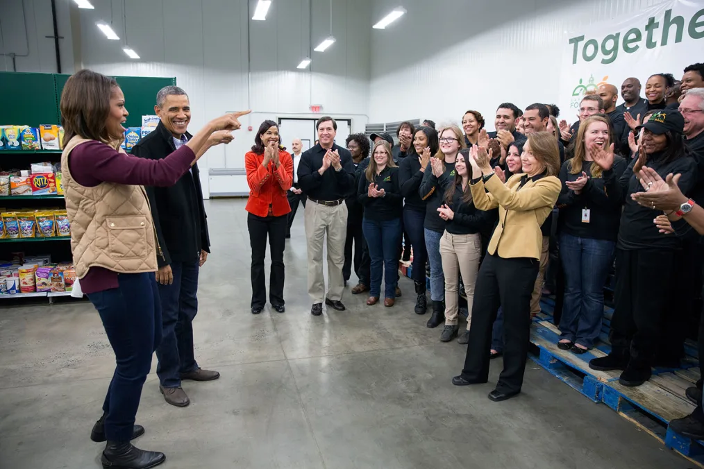 President Barack Obama and First Lady Michelle Obama greet staff and volunteers prior to a Thanksgiving service project at the Capital Area Food Bank in Washington, D.C., Nov. 27, 2013. (Official White House Photo by Pete Souza)