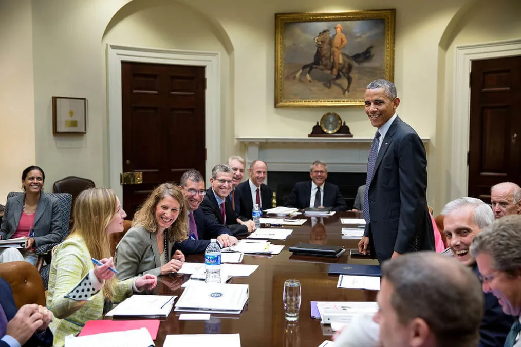 President Barack Obama laughing with staff