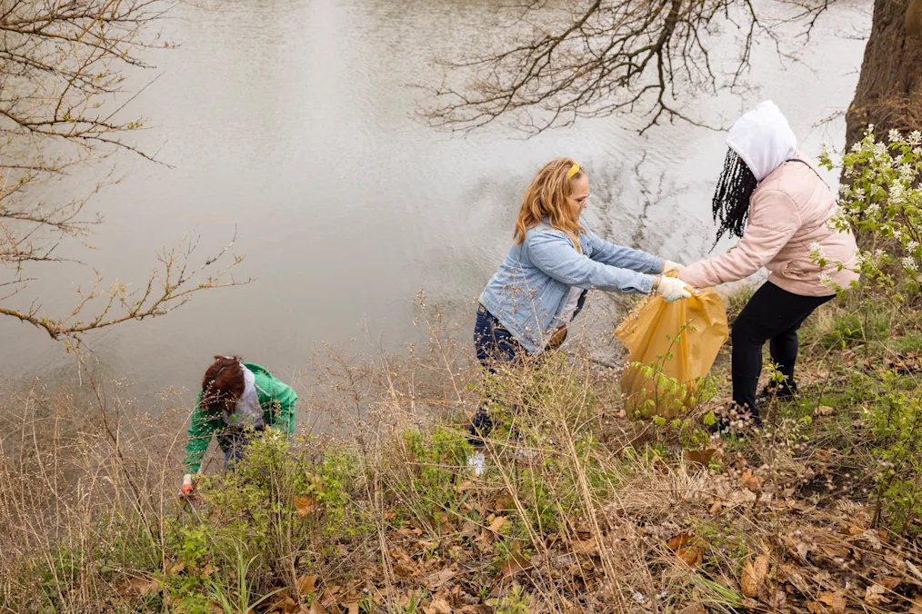 A group of three women with a range of light to dark skin tones collect trash around a pond. All are wearing gloves and jackets. ​​​​‌﻿‍﻿​‍​‍‌‍﻿﻿‌﻿​‍‌‍‍‌‌‍‌﻿‌‍‍‌‌‍﻿‍​‍​‍​﻿‍‍​‍​‍‌‍​﻿‌‍﻿﻿‌‍﻿‍‌﻿‌​‌‍‌‌‌‍﻿‍‌﻿‌​‌‍‌‍‌﻿‌‌‌‍﻿​​‍﻿‍‌‍​﻿‌‍﻿﻿‌‍﻿‌​‍​‍​‍﻿​​‍​‍‌‍‍​‌﻿​‍‌‍‌‌‌‍‌‍​‍​‍​﻿‍‍​‍​‍‌‍‍​‌﻿‌​‌﻿‌​‌﻿​​‌﻿​﻿​﻿‍‍​‍﻿﻿​‍﻿﻿‌‍​‌‌﻿​​‌﻿​​​‍﻿‍‌‍​﻿‌‍﻿﻿‌‍﻿‍‌﻿‌​‌‍‌‌‌‍﻿‍‌﻿‌​‌‍‌‍‌﻿‌‌‌‍﻿​​‍﻿‍‌‍​﻿‌‍﻿﻿‌‍﻿‌​‍﻿﻿‌﻿​﻿‌﻿​​‌‍​‌‌‍​﻿‌‍‌‌‌﻿​﻿​‍﻿﻿‌‍﻿​​﻿‌﻿‌‍‍​​﻿‌‌​﻿‍‌‌‍‍​‌‍‌‍‌‍﻿‍‌‍﻿​‌﻿‍​‌‍‍‍‌﻿‍​​‍﻿﻿‌‍‌‌‌‍﻿‍‌﻿‌‍‌‍‍‌‌﻿​‍‌‍﻿﻿‌‍﻿‍‌‍﻿‌‌‍‌‌‌‍﻿‍‌﻿‌​‌﻿​﻿​‍﻿﻿‌‍﻿‌‌‍​‌‌﻿​﻿‌﻿‌​‌‍‌‌‌﻿​‍​‍﻿﻿‌‍‌‌‌‍﻿‍‌﻿‌​‌﻿​‍‌‍‍‌‌‍‌‌‌﻿​﻿​‍﻿﻿​﻿‌‍‌‍‍​‌﻿‌​​﻿​﻿​﻿​﻿‌﻿‍‍‌‍‌‍‌​​﻿‌‌‍‌​﻿​​‌‍​‌‌​‍‌‌‌​​‌‍‌​‌﻿​‌​﻿‍​‌‌‌‌‌​‍‌‌​﻿﻿‌​‌﻿‌​﻿﻿​‍﻿﻿​﻿﻿﻿‌‍‌‍‌‍﻿﻿‌‍​﻿‌﻿‌‌‌﻿​﻿‌‍‌‌‌‍‌​‌​‌‍‌‍‍‌‌‍‌‌‌‍﻿​‌‍‌​​﻿﻿‌‌‍​‌‌‍﻿​‌﻿‌​‌‌‌​‌‍‌‌‌﻿‍​‌﻿‌​​‍‌‍‌‍‌‍‌‍﻿﻿‌‍​﻿‌﻿‌‌‌﻿​﻿‌‍‌‌‌‍‌​‌​﻿​‌‍﻿﻿‌‍​﻿‌‍​‌‌‍﻿​‌‍‌‌​﻿﻿‌‌‍‌‌‌‍﻿‍​‍﻿‌‌‌‌‌‌‌​﻿​‍‌‍‌﻿​﻿‌‍﻿﻿‌﻿‌‌‌﻿​‍‌‍​﻿‌‍‌‌​﻿﻿‌‌﻿‌‍‌‍‌‌‌﻿​‍‌‍​﻿‌‍‌‌‌‍﻿​​‍﻿‌‌‍​﻿‌‍﻿﻿‌‍﻿‍‌﻿‌​‌‍‌‌‌‍﻿‍‌﻿‌​​‍﻿‌‌‍﻿​‌‍‍‌‌‍﻿‍‌‍‍﻿​‍​‍​‍﻿​​‍​‍‌‍​﻿‌‍﻿﻿‌‍﻿‍‌﻿‌​‌‍‌‌‌‍﻿‍‌﻿‌​‌‍‌‍‌﻿‌‌‌‍﻿​​‍​‍​﻿‍‍‌﻿‍﻿​‍​‍‌‍‌‌‌‍‌​‌‍‍‌‌﻿‌​‌‍﻿﻿‌﻿​‍‌​‍‌‌‍﻿‍‌﻿‌​‌‍‌‌‌﻿​‍‌‍‌‍‌‍​‌‌‍​﻿‌‍‌‌​‍​‍​﻿‍‍‌﻿‍﻿​‍​‍‌﻿‌﻿‌‍‍‌‌‍‌​‌‍‌﻿‌‍‌‌‌﻿‌​‌​‍‌‌‍‌​​‍​‍​﻿‍‍​‍​‍‌‍﻿‌‌﻿‌‌‌‍﻿​‌﻿‌​‌‍‍‌‌﻿​​‌‍﻿​‌‍‌‌‌​﻿​‌‍‍‌‌‍﻿‍‌‍‌‌​‍​‍​‍﻿​​‍​‍‌﻿‌﻿‌‍‍‌‌‍‌​‌‍‌﻿‌‍‌‌‌﻿‌​‌​﻿‍‌‍​‌‌‍﻿‌‌‍‌‌‌﻿​﻿‌﻿​​‌‍​‌‌‍​﻿‌‍‌‌​‍​‍​﻿‍‍​‍​‍‌‍​‍‌﻿‌‌‌‍‍‌‌‍﻿​‌﻿‌​‌‍‍‌‌‍﻿‍​‍​‍‌﻿﻿‌​‍﻿​​‍​‍‌‍‌‍‌‍‍‌‌‍‌‌‌‍﻿​‌‍‌​‌‌‌​‌﻿‍‌‌﻿​​‌‍‌‌​‍​‍​﻿‍‍​‍​‍‌‌‌​‌‍‌‌‌﻿‍​‌﻿‌​​‍​‍‌﻿﻿‌‌﻿﻿‌