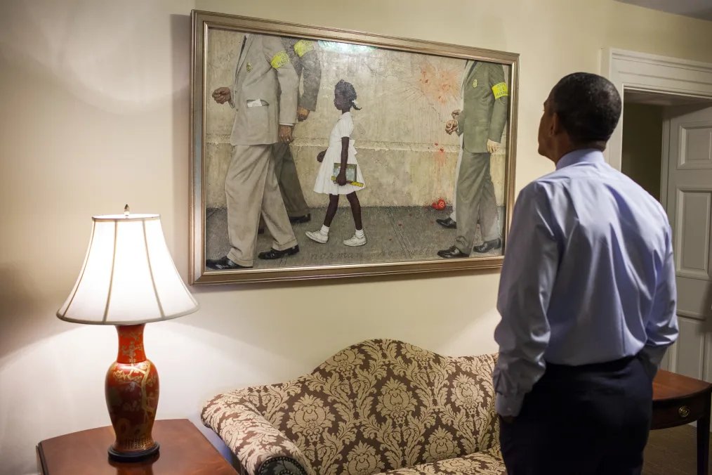 President Obama looks at the Norman Rockwell painting, "The Problem We All Live With," just hung in the Outer Oval Office, June 22, 2011.