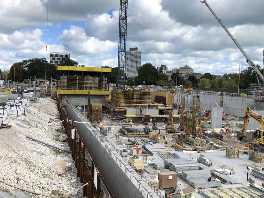 

 A wide shot of the construction on the site of the Obama Presidential Center in the daytime.
