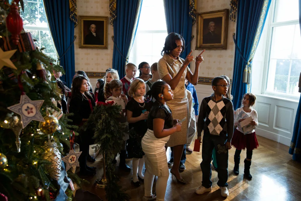 First Lady Michelle Obama walks with children of military families
