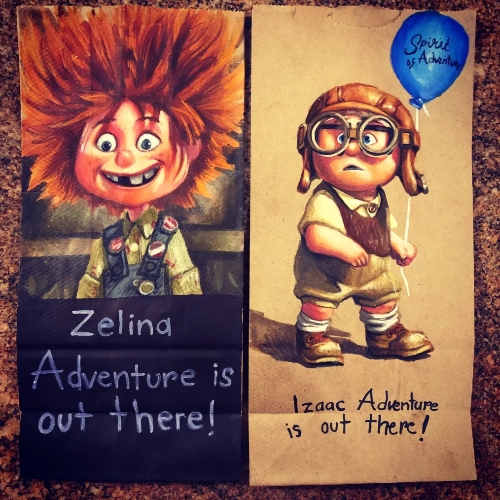 A painting on a brown paper bag of a cartoon young girl with a light skin tone, red spikey hair, and missing teeth. She wears overalls and buttons while the text beneath reads "Zelina Adventure Is Out There". Beside it is another painting on a brown paper bag of a cartoon young boy with a light skin tone wearing a large hat and goggles while holding a blue balloon. Below the painting, the text reads "Izaac Adventure Is Out There "