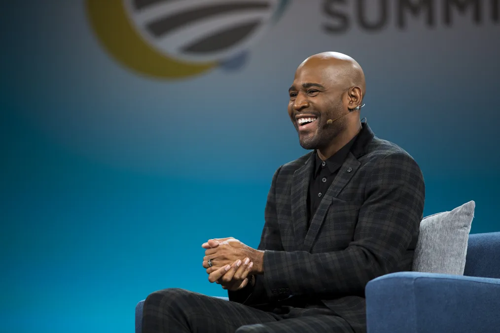 Karamo Brown smiles at the audience during his Summit conversation with Tara Westover.