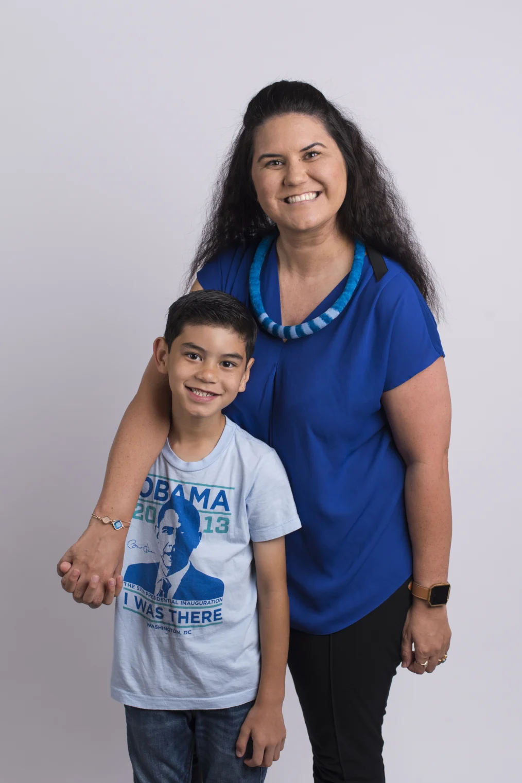 Kealoha Fox and her son smile to camera and embrace.