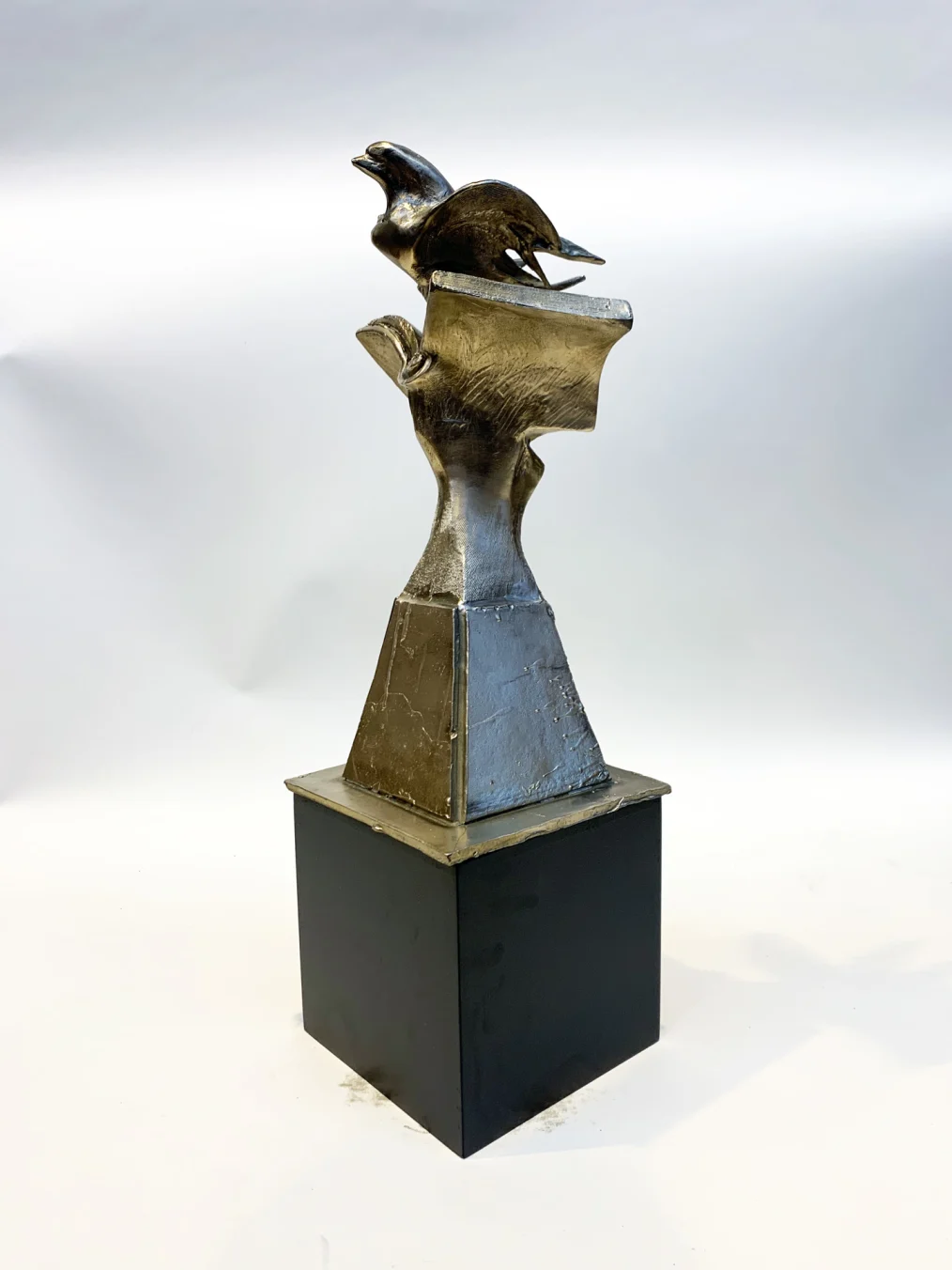 A miniature model of Richard Hunt's "Book Bird," made of bronze.