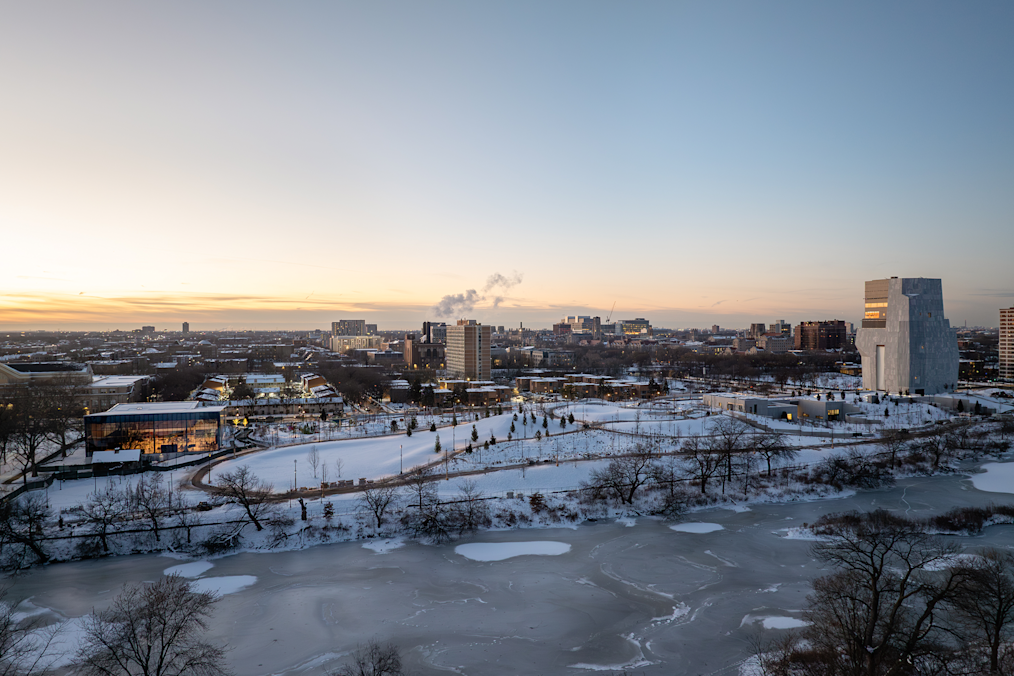 An aerial view of the South Side of Chicago on a snowy day. The image features the entirety of the Obama Presidential Center campus. 