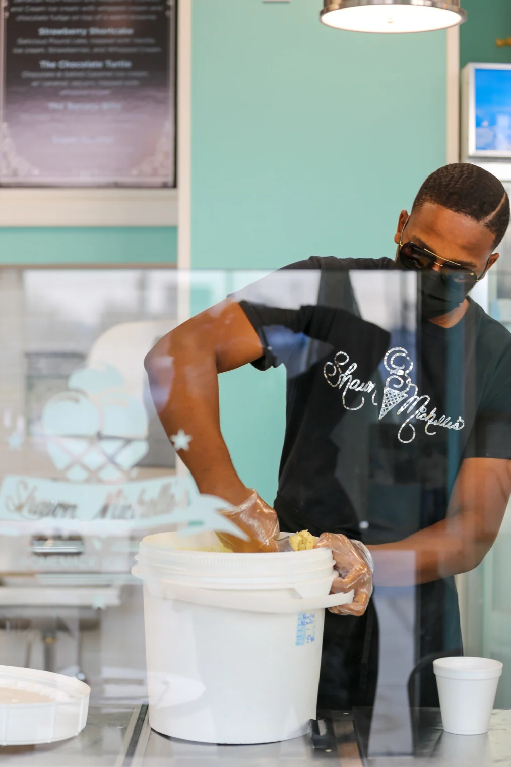 A server scoops ice cream at Shawn Michelle's.