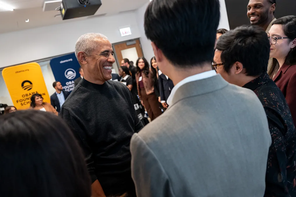 President Obama stands in a circle as he greets Obama Foundation Scholars at Home Court at the Obama Presidential Center on Dec. 8, 2025. Scholars are a range of ages, backgrounds, and light to dark skin tones. A yellow sign in the background reads, “Obama Foundation Scholars.”​​​​‌﻿‍﻿​‍​‍‌‍﻿﻿‌﻿​‍‌‍‍‌‌‍‌﻿‌‍‍‌‌‍﻿‍​‍​‍​﻿‍‍​‍​‍‌‍​﻿‌‍﻿﻿‌‍﻿‍‌﻿‌​‌‍‌‌‌‍﻿‍‌﻿‌​‌‍‌‍‌﻿‌‌‌‍﻿​​‍﻿‍‌‍​﻿‌‍﻿﻿‌‍﻿‌​‍​‍​‍﻿​​‍​‍‌‍‍​‌﻿​‍‌‍‌‌‌‍‌‍​‍​‍​﻿‍‍​‍​‍‌‍‍​‌﻿‌​‌﻿‌​‌﻿​​‌﻿​﻿​﻿‍‍​‍﻿﻿​‍﻿﻿‌‍​‌‌﻿​​‌﻿​​​‍﻿‍‌‍​﻿‌‍﻿﻿‌‍﻿‍‌﻿‌​‌‍‌‌‌‍﻿‍‌﻿‌​‌‍‌‍‌﻿‌‌‌‍﻿​​‍﻿‍‌‍​﻿‌‍﻿﻿‌‍﻿‌​‍﻿﻿‌﻿​﻿‌﻿​​‌‍​‌‌‍​﻿‌‍‌‌‌﻿​﻿​‍﻿﻿‌‍﻿​​﻿‌﻿‌‍‍​​﻿‌‌​﻿‍‌‌‍‍​‌‍‌‍‌‍﻿‍‌‍﻿​‌﻿‍​‌‍‍‍‌﻿‍​​‍﻿﻿‌‍‌‌‌‍﻿‍‌﻿‌‍‌‍‍‌‌﻿​‍‌‍﻿﻿‌‍﻿‍‌‍﻿‌‌‍‌‌‌‍﻿‍‌﻿‌​‌﻿​﻿​‍﻿﻿‌‍﻿‌‌‍​‌‌﻿​﻿‌﻿‌​‌‍‌‌‌﻿​‍​‍﻿﻿‌‍‌‌‌‍﻿‍‌﻿‌​‌﻿​‍‌‍‍‌‌‍‌‌‌﻿​﻿​‍﻿﻿​﻿​﻿‌‍‍​‌‌‍‌​﻿‌‌‌﻿‍‌‌‍​‌‌​‌‍‌﻿‌﻿‌​‌‍​﻿‌‌‌‍‍‍​﻿‍‌​﻿‍‌‌​‍‍‌‍‍​​﻿‌‍‌​﻿‍‌‍﻿​‌﻿‌‌‌​‍‌‌‍﻿‍​‍﻿﻿​﻿﻿﻿‌‍‌‍‌‍﻿﻿‌‍​﻿‌﻿‌‌‌﻿​﻿‌‍‌‌‌‍‌​‌​‌‍‌‍‍‌‌‍‌‌‌‍﻿​‌‍‌​​﻿﻿‌‌‍​‌‌‍﻿​‌﻿‌​‌‌‌​‌‍‌‌‌﻿‍​‌﻿‌​​‍‌‍‌‍‌‍‌‍﻿﻿‌‍​﻿‌﻿‌‌‌﻿​﻿‌‍‌‌‌‍‌​‌​﻿​‌‍﻿﻿‌‍​﻿‌‍​‌‌‍﻿​‌‍‌‌​﻿﻿‌‌‍‌‌‌‍﻿‍​‍﻿‌‌‌‌‌‌‌​﻿​‍‌‍‌﻿​﻿‌‍﻿﻿‌﻿‌‌‌﻿​‍‌‍​﻿‌‍‌‌​﻿﻿‌‌﻿‌‍‌‍‌‌‌﻿​‍‌‍​﻿‌‍‌‌‌‍﻿​​‍﻿‌‌‍​﻿‌‍﻿﻿‌‍﻿‍‌﻿‌​‌‍‌‌‌‍﻿‍‌﻿‌​​‍﻿‌‌‍﻿​‌‍‍‌‌‍﻿‍‌‍‍﻿​‍​‍​‍﻿​​‍​‍‌‍​﻿‌‍﻿﻿‌‍﻿‍‌﻿‌​‌‍‌‌‌‍﻿‍‌﻿‌​‌‍‌‍‌﻿‌‌‌‍﻿​​‍​‍​﻿‍‍‌﻿‍﻿​‍​‍‌‍‌‌‌‍‌​‌‍‍‌‌﻿‌​‌‍﻿﻿‌﻿​‍‌​‍‌‌‍﻿‍‌﻿‌​‌‍‌‌‌﻿​‍‌‍‌‍‌‍​‌‌‍​﻿‌‍‌‌​‍​‍​﻿‍‍‌﻿‍﻿​‍​‍‌﻿‌﻿‌‍‍‌‌‍‌​‌‍‌﻿‌‍‌‌‌﻿‌​‌​‍‌‌‍‌​​‍​‍​﻿‍‍​‍​‍‌‍﻿‌‌﻿‌‌‌‍﻿​‌﻿‌​‌‍‍‌‌﻿​​‌‍﻿​‌‍‌‌‌​﻿​‌‍‍‌‌‍﻿‍‌‍‌‌​‍​‍​‍﻿​​‍​‍‌﻿‌﻿‌‍‍‌‌‍‌​‌‍‌﻿‌‍‌‌‌﻿‌​‌​﻿‍‌‍​‌‌‍﻿‌‌‍‌‌‌﻿​﻿‌﻿​​‌‍​‌‌‍​﻿‌‍‌‌​‍​‍​﻿‍‍​‍​‍‌‍​‍‌﻿‌‌‌‍‍‌‌‍﻿​‌﻿‌​‌‍‍‌‌‍﻿‍​‍​‍‌﻿﻿‌​‍﻿​​‍​‍‌‍‌‍‌‍‍‌‌‍‌‌‌‍﻿​‌‍‌​‌‌‌​‌﻿‍‌‌﻿​​‌‍‌‌​‍​‍​﻿‍‍​‍​‍‌‌‌​‌‍‌‌‌﻿‍​‌﻿‌​​‍​‍‌﻿﻿‌‌﻿﻿‌