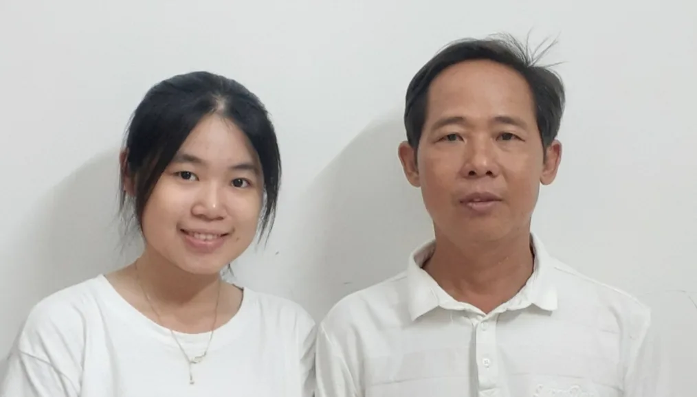 Cường with his daughter Thanh Mai