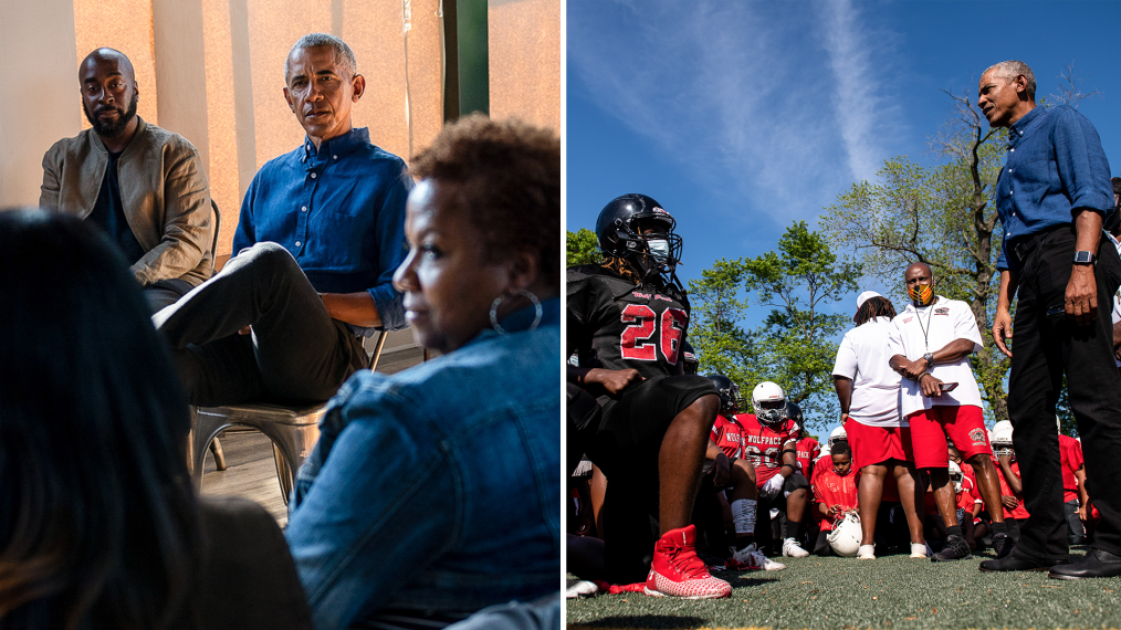 One picture of Barack Obama a black man wearing a blue button up shirt sitting and talking to two women with a medium brown skin tone and a man with a dark brown skin tone, The second picture of Barack Obama standing outside with a group of young men with various dark brown skin tones kneeling around him wearing red,black, and white football gear