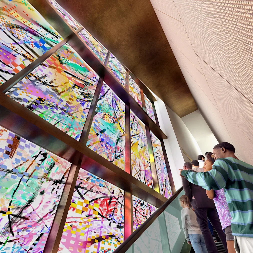 A rendering of the interior escalator at the Obama Presidential Center Museum. The escalator is situated on the interior side of the art installation, "Uprising of the Sun." The mosaic art installation includes multiple colors and is glass. On the upward escalator are several children pointing to the glass mosaic art installation.