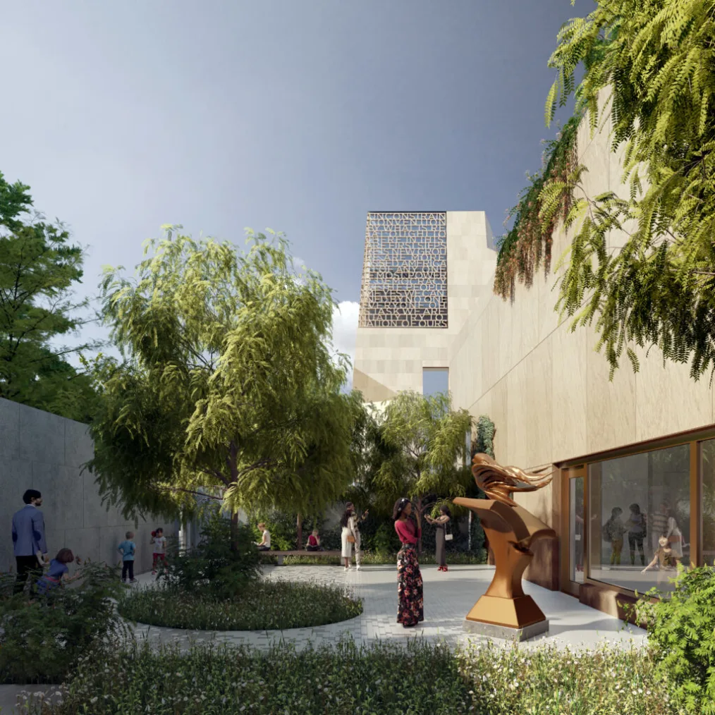 A rendering shows the Obama Presidential Center from a garden, where a person stands in front of a bronze sculpture of a bird emerging from a book.