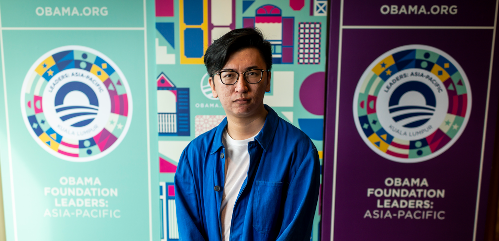 The designer for Leaders: Asia-Pacific, Valen Lim Chong Chin stands in front of his work.