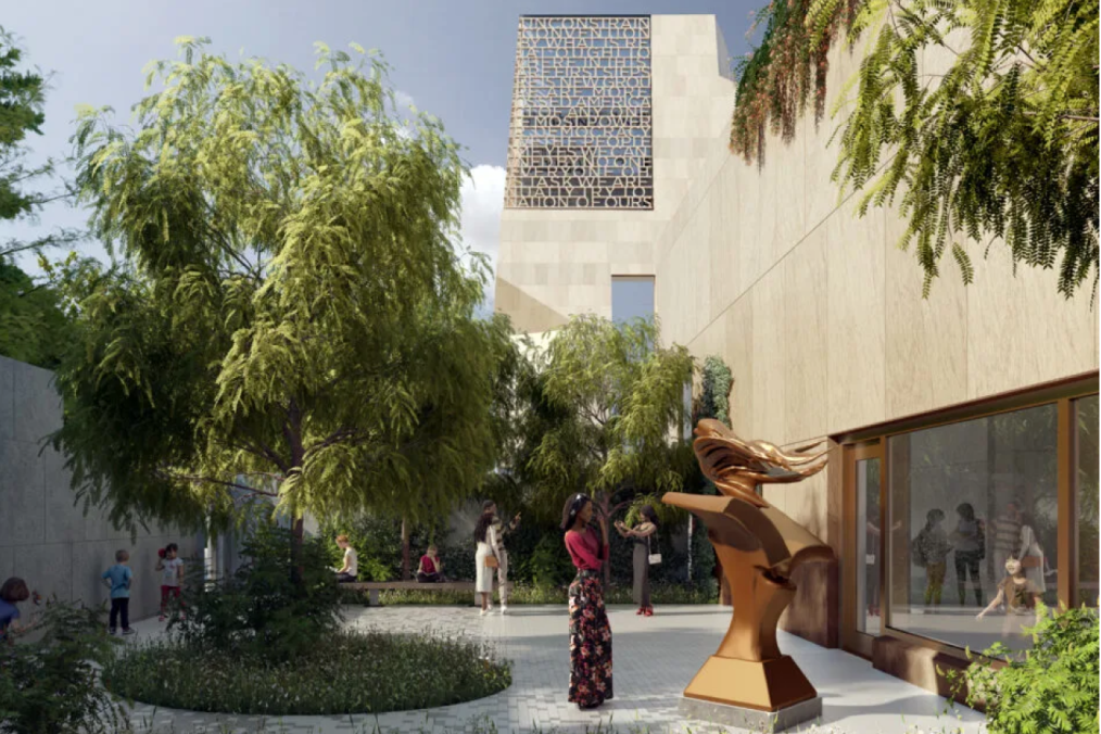 A rendering shows the Obama Presidential Center from a garden, where a person stands in front of a bronze sculpture of a bird emerging from a book.