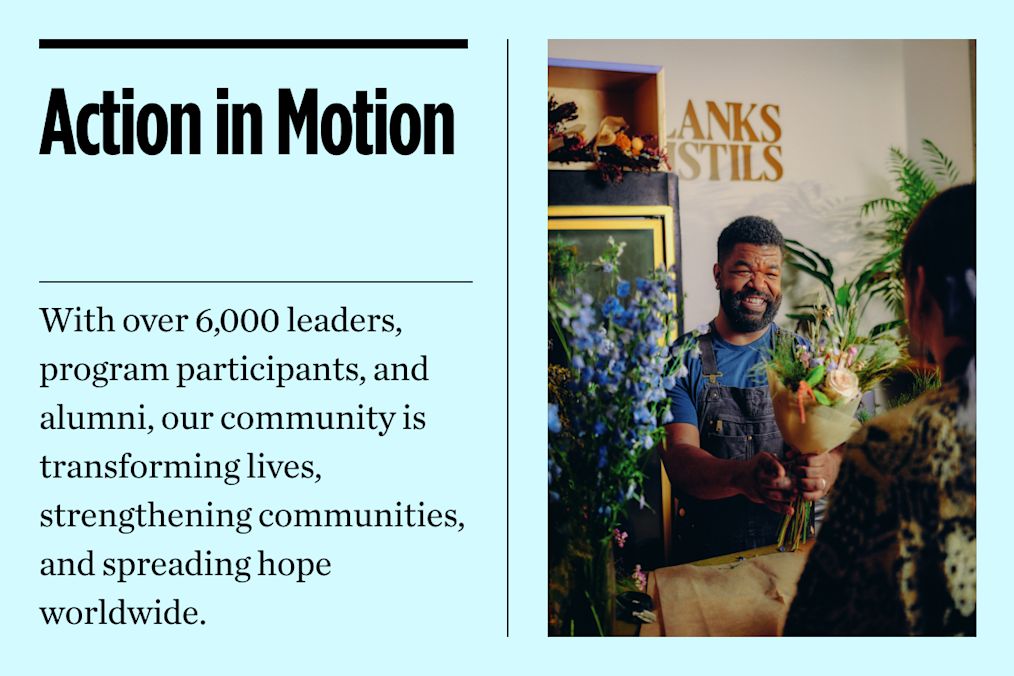 A graphic with a photo on one side and text on the other. The photo is of a man with medium-dark skin tone and beardd handing flowers to another person. The text on the left reads "Action in Motion. With over 6,000 leaders, program participants and alumni, our community is transforming lives, strengthening communities and spreading hope worldwide."