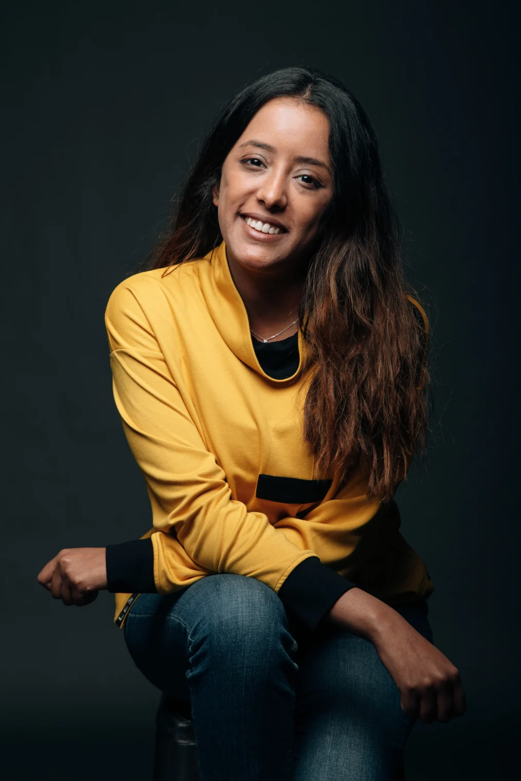 Salmine sits for a portrait.