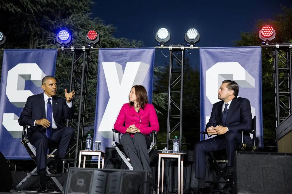 President Barack Obama sitting with Leonardo DiCaprio and Dr. Katharine Hayhoe