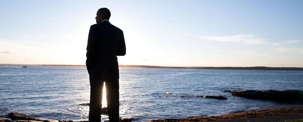 President Obama looks out over the water