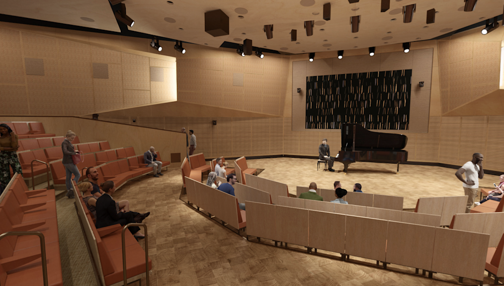 A digital rendering of the Elie Wiesel Auditorium. Tiered seating surrounds a performance stage. Lighting and speakers hang from the ceiling.