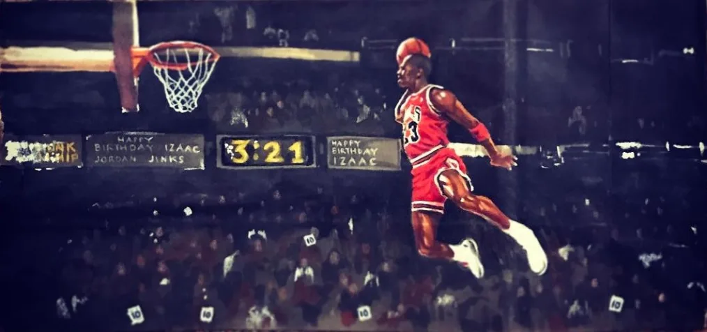 A painting of Michael Jordan, a man with a deep skin tone and short hair jumping into the air in a red basketball uniform holding a basketball. 