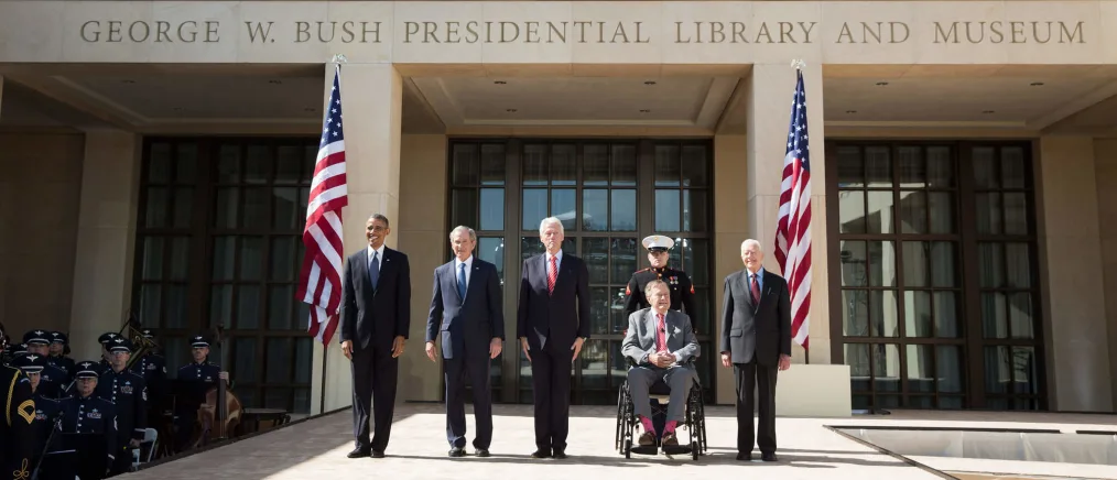 President Barack Obama pauses at the George W. Bush library