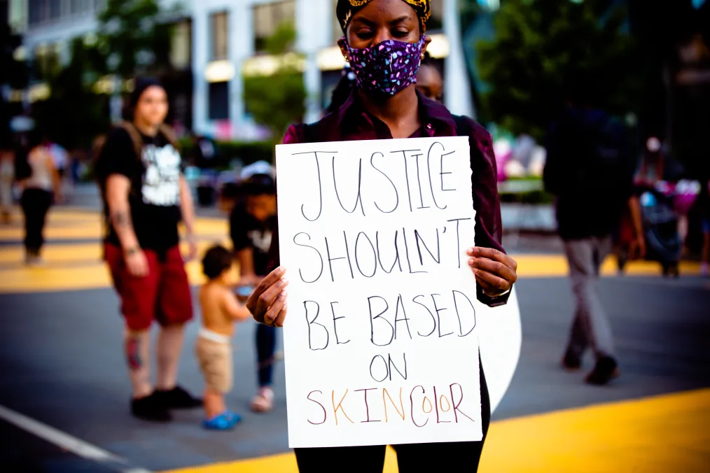 young woman with justice sign