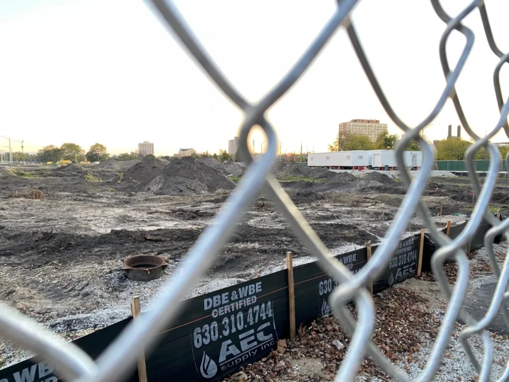 The construction site for the Obama Presidential Center is shown through the links in a metal fence.