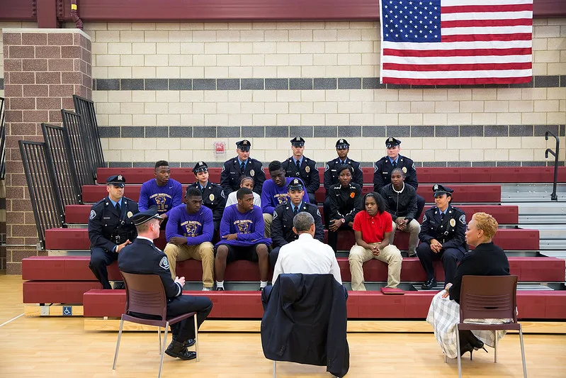 President Obama talks with students and law enforcement officials about community relations and programs that build trust between youth and the police in Camden, N.J.